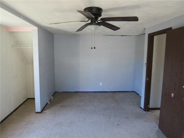 unfurnished bedroom with light carpet and ceiling fan