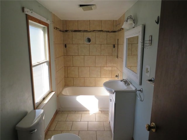 bathroom featuring tile patterned floors, visible vents, toilet, vanity, and shower / bathtub combination