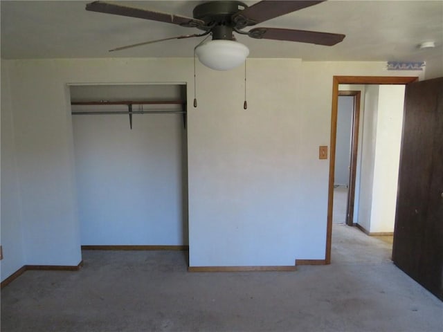 unfurnished bedroom featuring light colored carpet, ceiling fan, and a closet