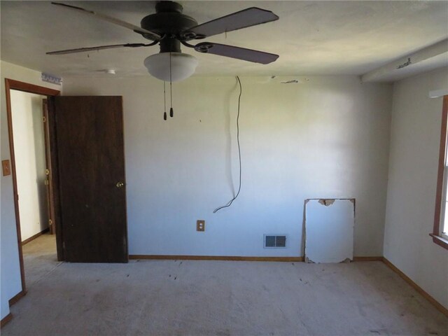 carpeted empty room with ceiling fan