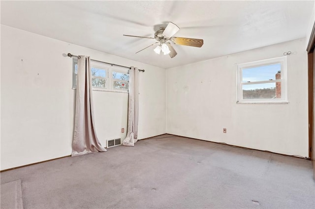 unfurnished room with light carpet and ceiling fan