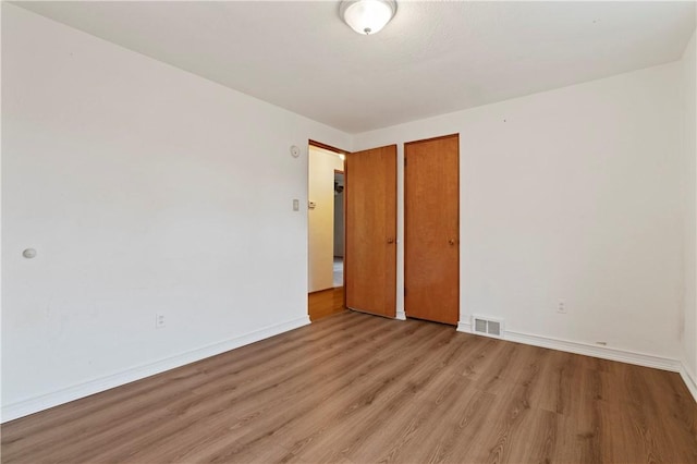 unfurnished bedroom featuring light hardwood / wood-style flooring