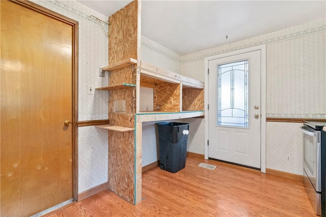 entrance foyer featuring hardwood / wood-style flooring