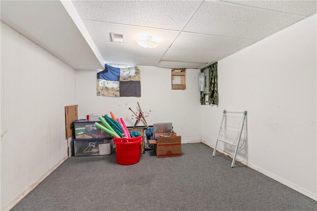 rec room with a paneled ceiling and carpet flooring