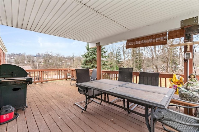 wooden terrace featuring area for grilling