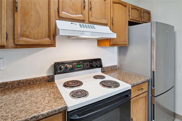 kitchen with stainless steel refrigerator and electric range