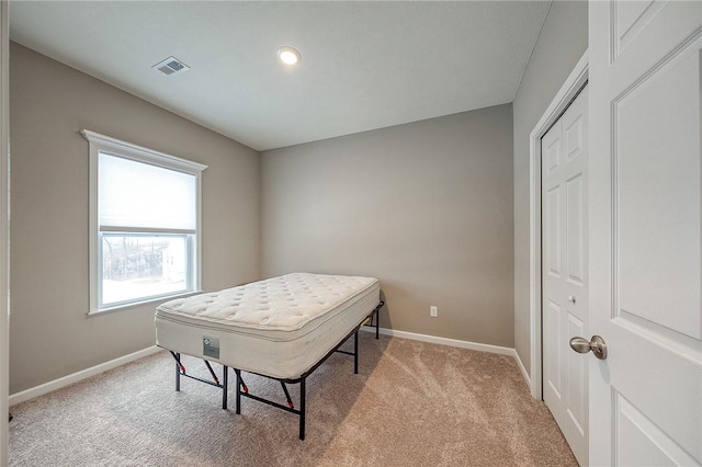 carpeted bedroom featuring a closet