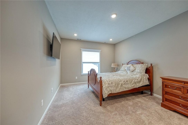 bedroom featuring light colored carpet