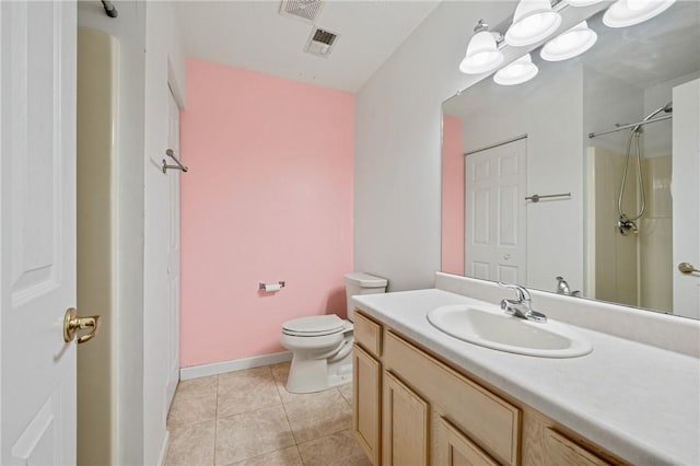 bathroom with walk in shower, vanity, toilet, and tile patterned flooring