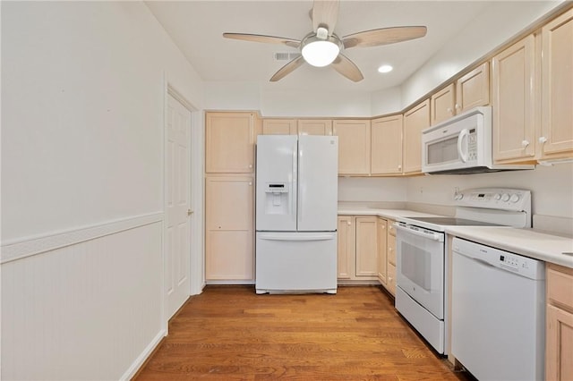 kitchen with ceiling fan, white appliances, light brown cabinetry, and light hardwood / wood-style floors