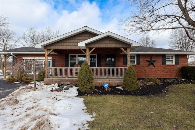 view of front of home with a yard and a porch