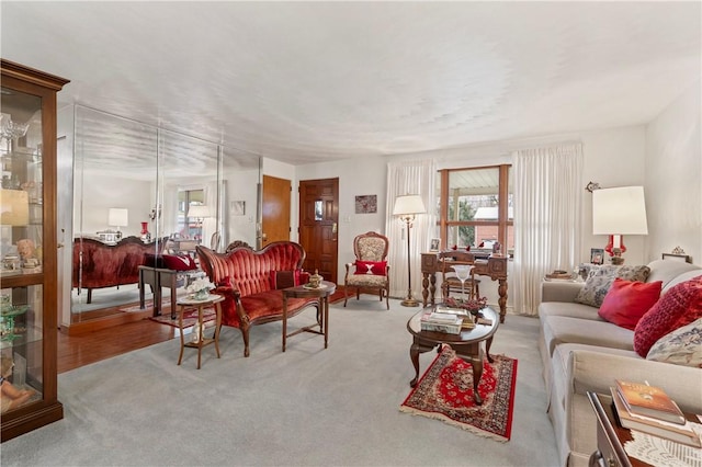 carpeted living room with a healthy amount of sunlight