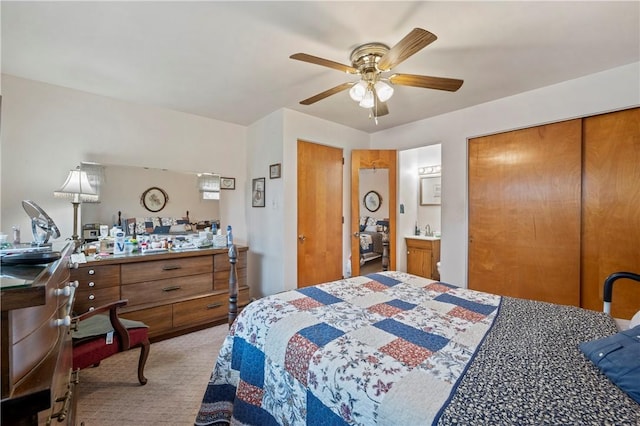 carpeted bedroom featuring a closet and ceiling fan