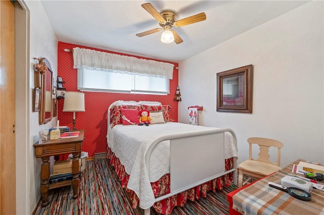 bedroom featuring a baseboard radiator and ceiling fan