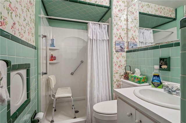 bathroom featuring vanity, tile walls, walk in shower, and toilet