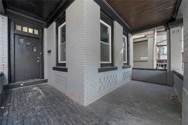 doorway to property featuring covered porch