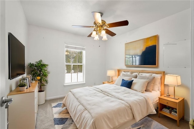 bedroom featuring ceiling fan and light colored carpet