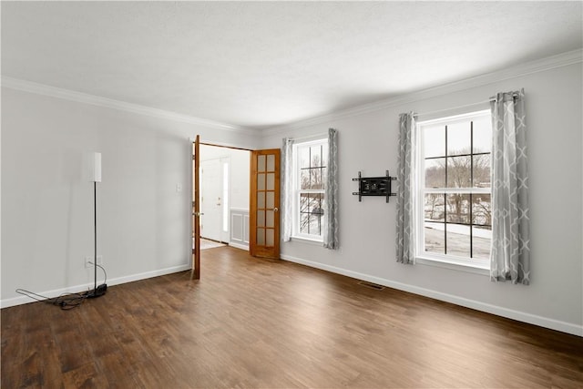 unfurnished room with ornamental molding and dark hardwood / wood-style flooring