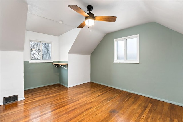 bonus room featuring ceiling fan, wood-type flooring, and vaulted ceiling