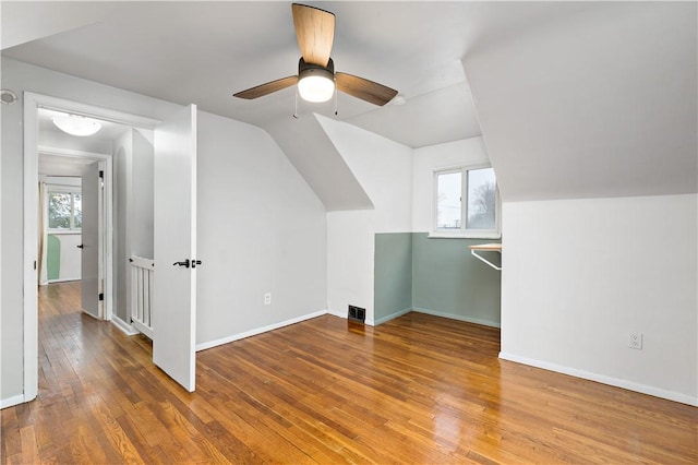 bonus room featuring hardwood / wood-style floors, plenty of natural light, and vaulted ceiling