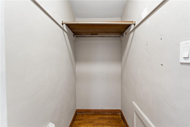 spacious closet featuring hardwood / wood-style floors