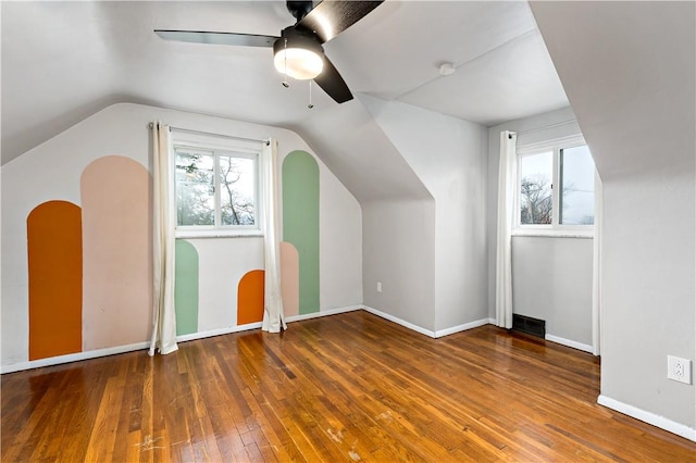 bonus room with ceiling fan, lofted ceiling, and hardwood / wood-style floors