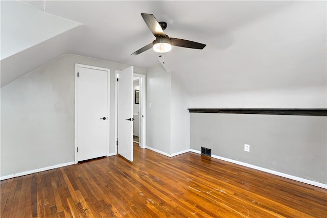 bonus room featuring lofted ceiling, hardwood / wood-style floors, and ceiling fan