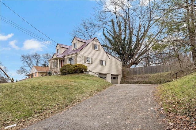 view of property exterior with a garage and a yard