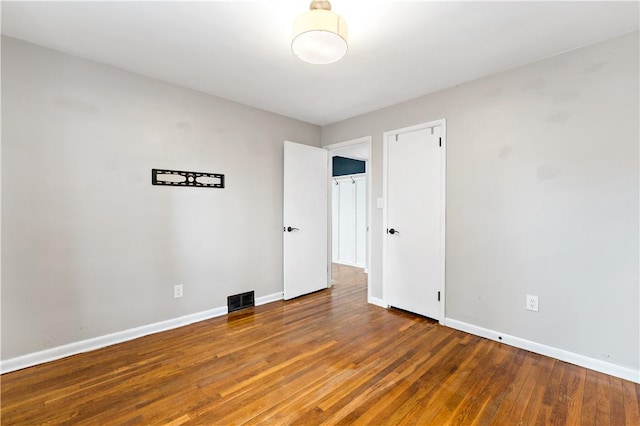 empty room featuring dark hardwood / wood-style floors