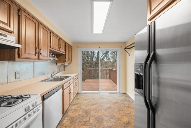 8422 Roosevelt Blvd, Mccandless, PA 15237 - kitchen featuring appliances with stainless steel finishes, light countertops, extractor fan, light stone finish floors, and brown cabinetry