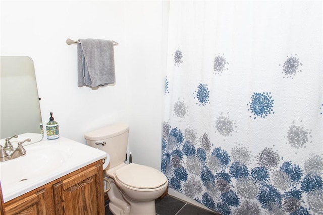 bathroom with vanity, tile patterned floors, and toilet