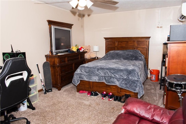 carpeted bedroom with ceiling fan and a wall unit AC