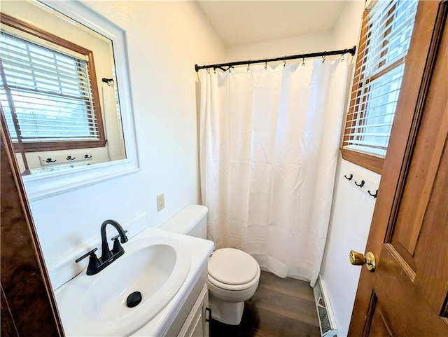 bathroom with vanity, a shower with curtain, and toilet