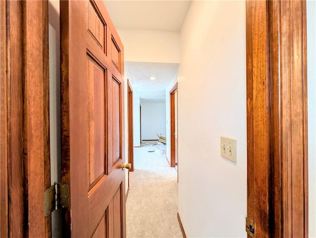 corridor with light colored carpet