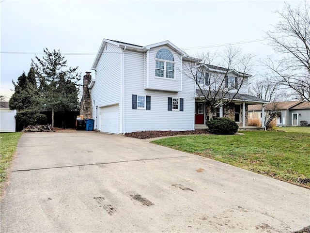 view of front property with a garage and a front lawn