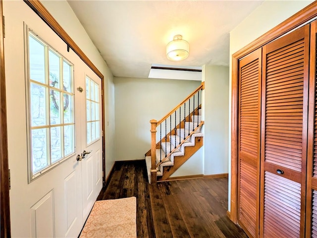 foyer entrance featuring dark hardwood / wood-style floors