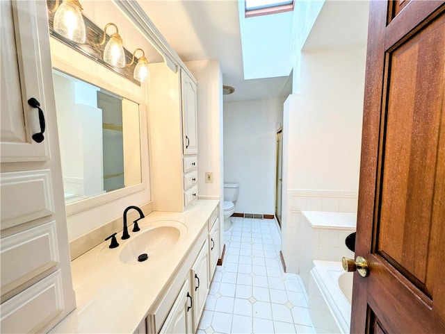 full bathroom featuring vanity, toilet, and shower with separate bathtub