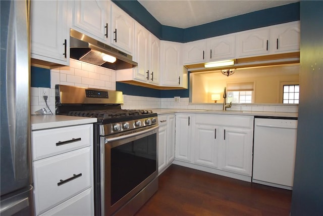 kitchen featuring white cabinetry, sink, backsplash, and appliances with stainless steel finishes