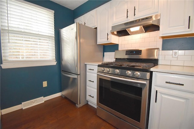 kitchen featuring stainless steel appliances, tasteful backsplash, white cabinets, and dark hardwood / wood-style flooring