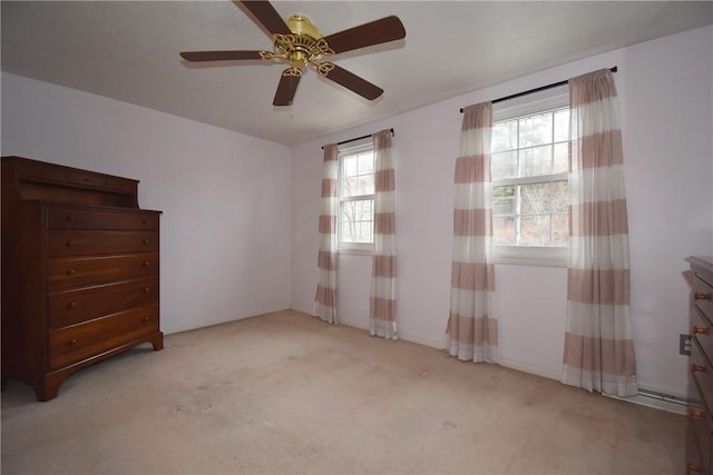 spare room with light carpet and ceiling fan