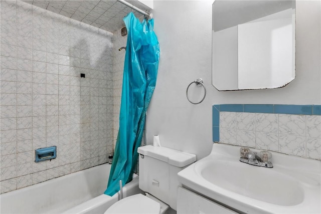 full bathroom with vanity, shower / bath combination with curtain, and toilet