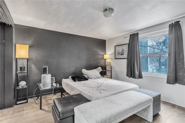 bedroom with light wood-type flooring