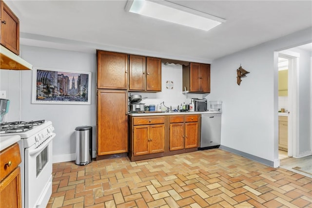 kitchen with dishwasher, sink, and gas range gas stove