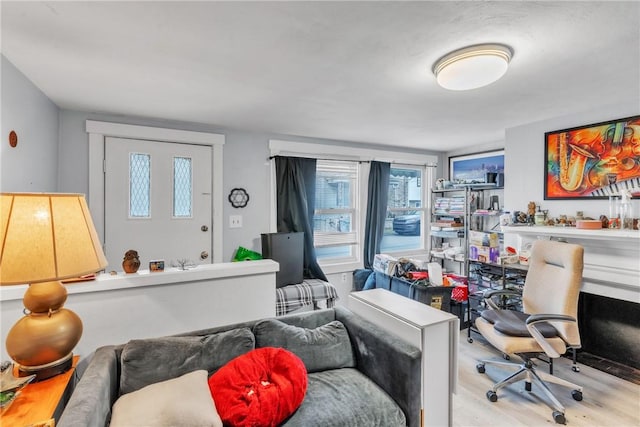 office area with light hardwood / wood-style floors