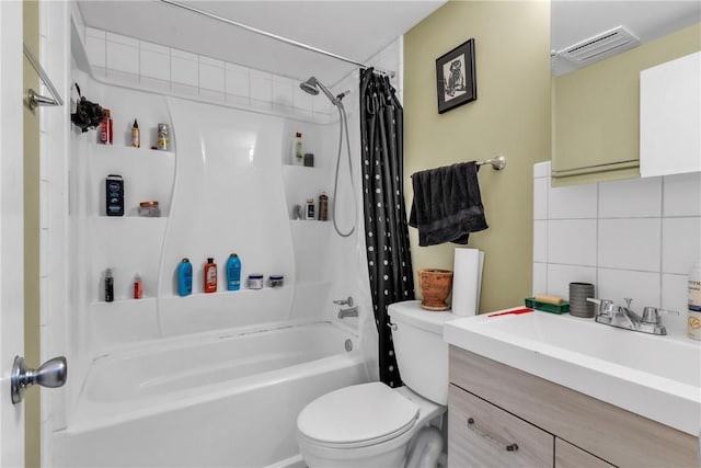 full bathroom with tasteful backsplash, shower / bathtub combination with curtain, vanity, and toilet