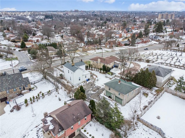 snowy aerial view featuring a residential view