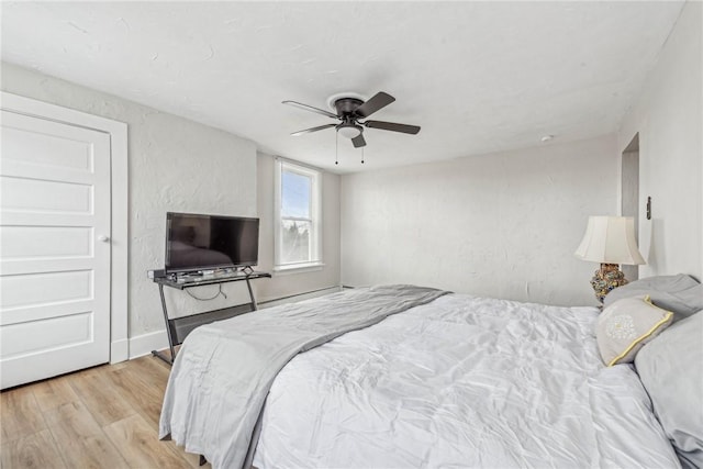 bedroom featuring wood finished floors and a ceiling fan