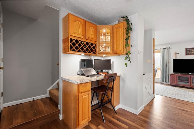 interior space with hardwood / wood-style floors and a textured ceiling