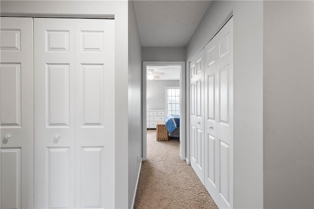 corridor featuring carpet flooring