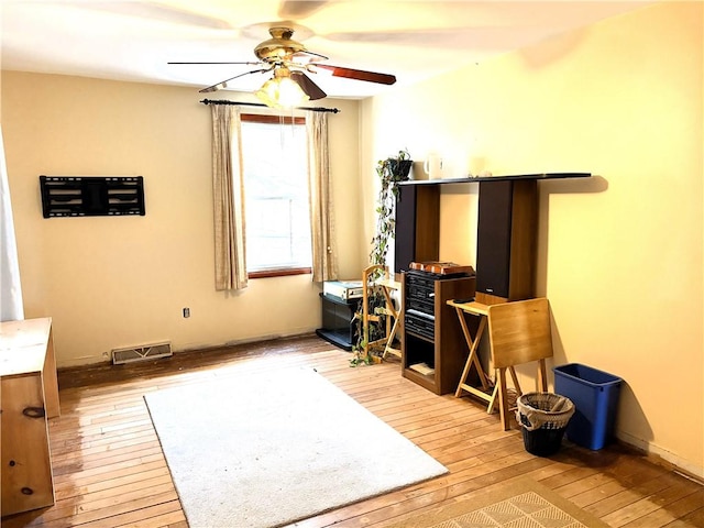 interior space featuring ceiling fan and light hardwood / wood-style floors